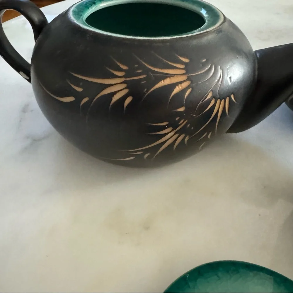 Carved Vietnamese tea kettle set with 2 small tea cups